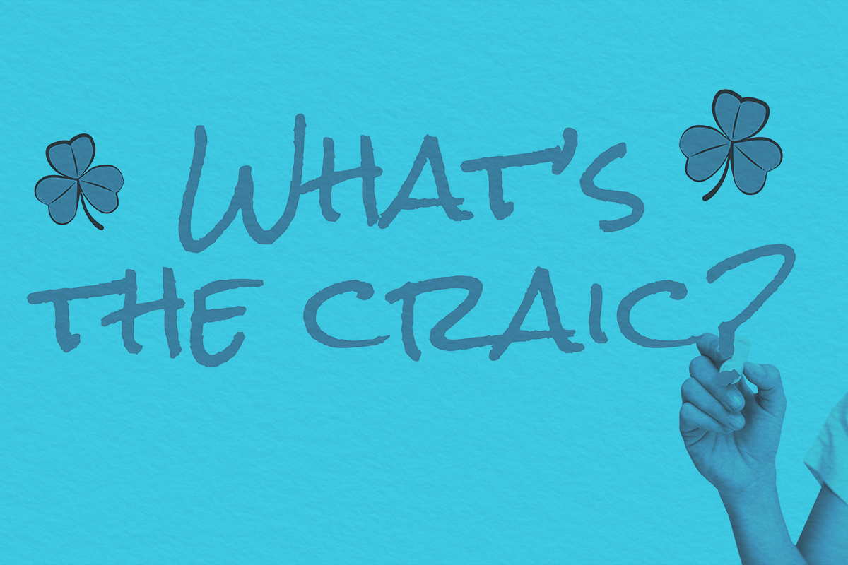 "What's the craic?" written with marker and four leaf clovers