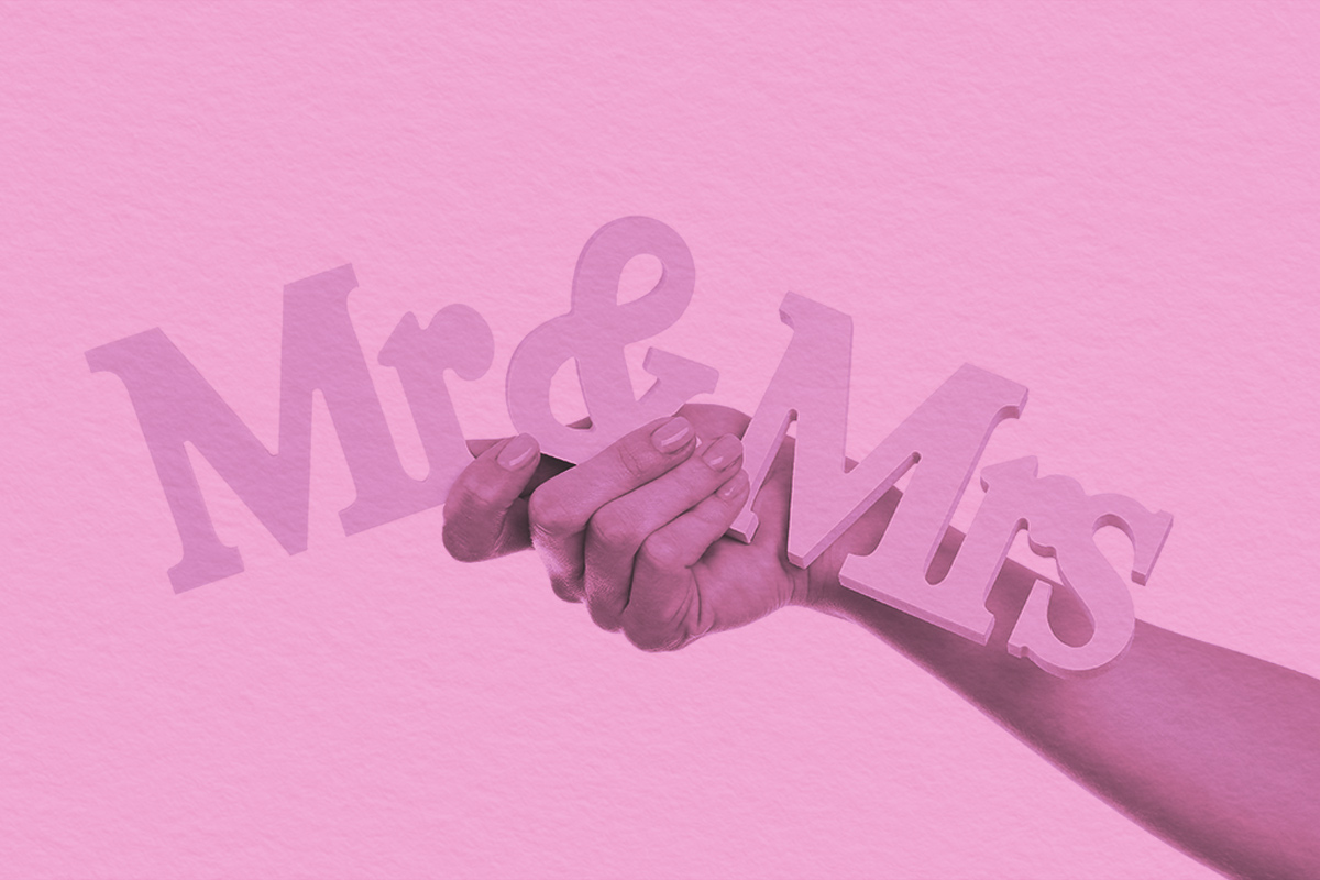 hands holding letters Mr and Mrs