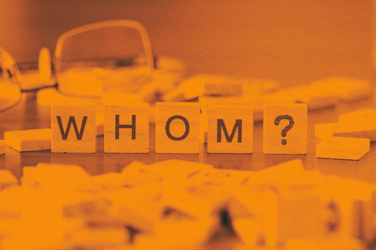 whom? word or concept represented by wooden letter tiles