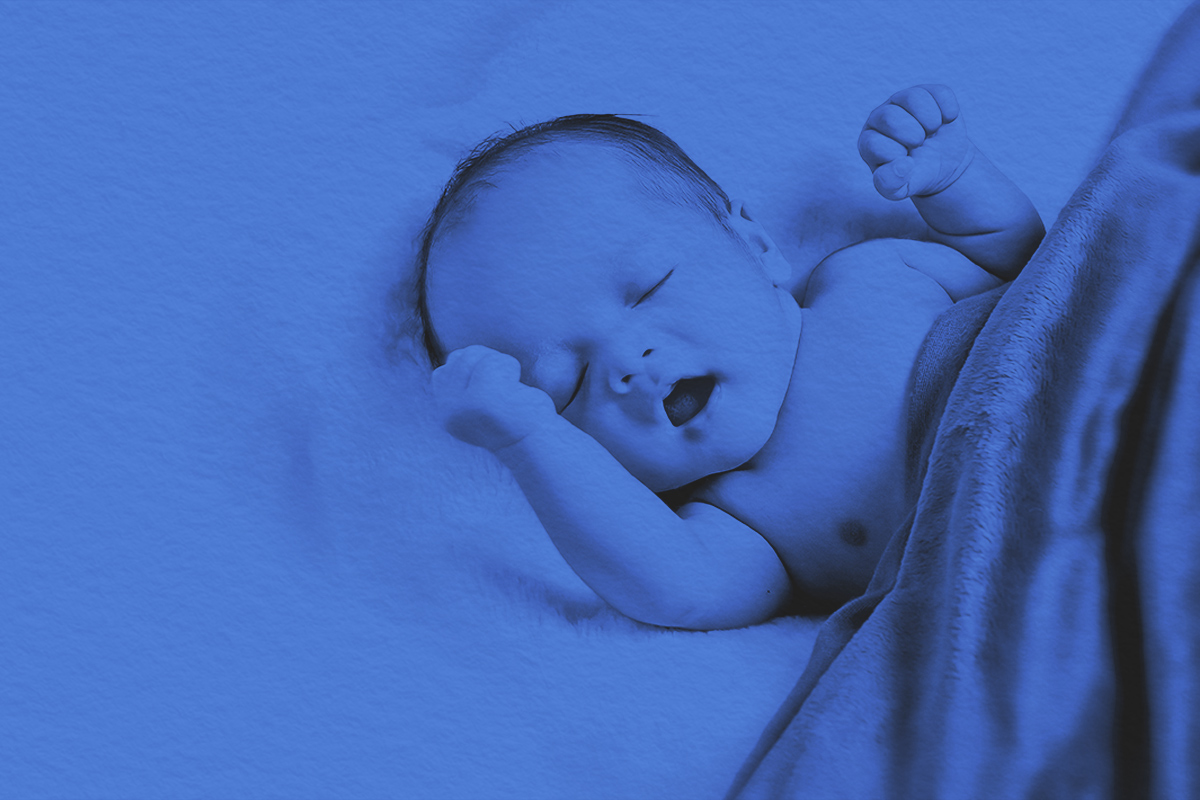 Baby Lying On Fur With Blanket on top