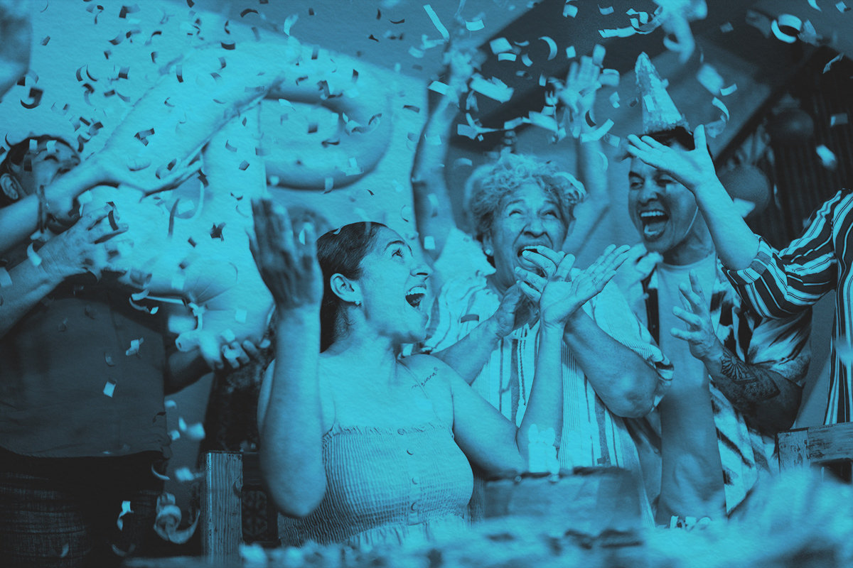 woman celebrating birthday with family at home