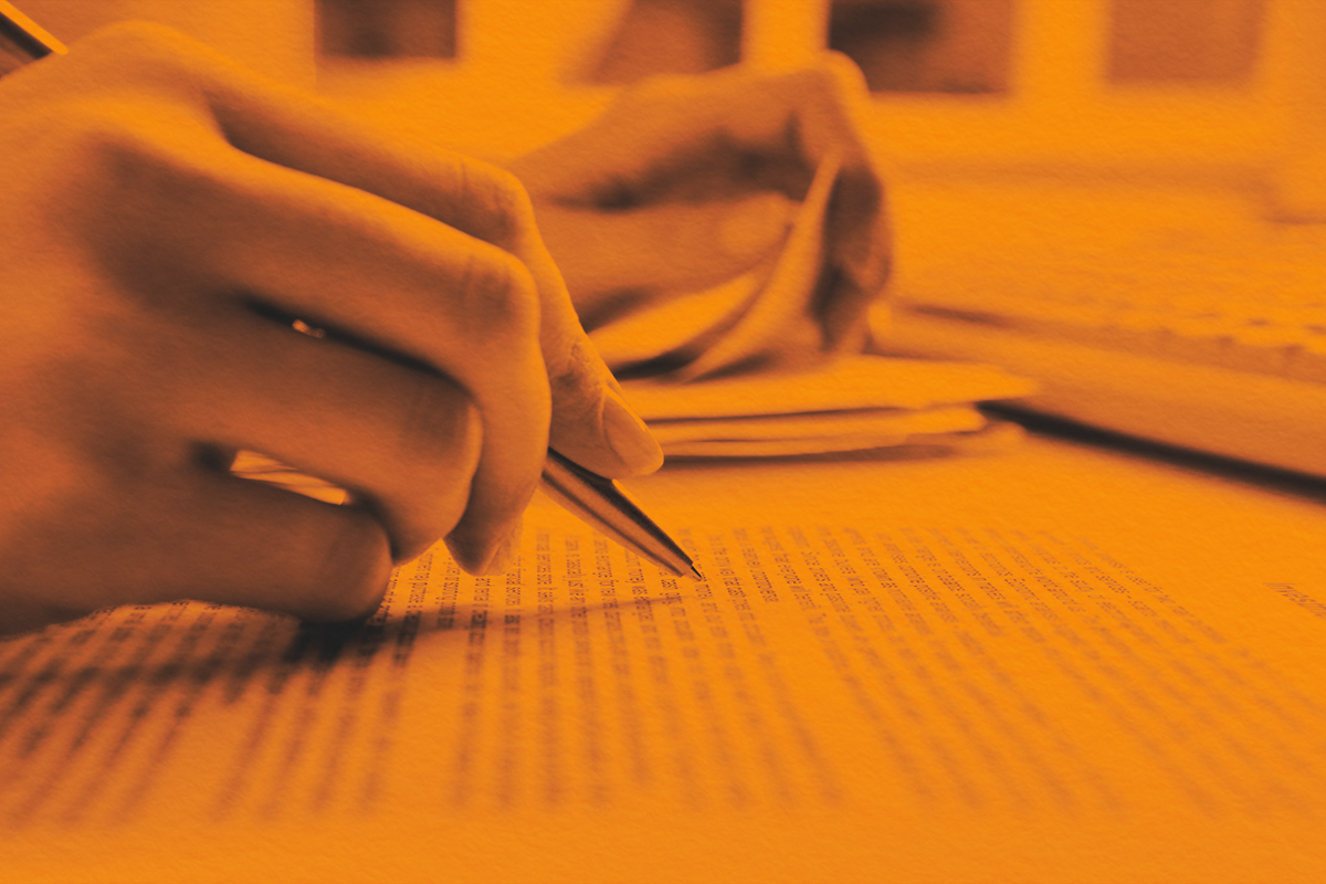 Close-up of human hands doing paperwork
