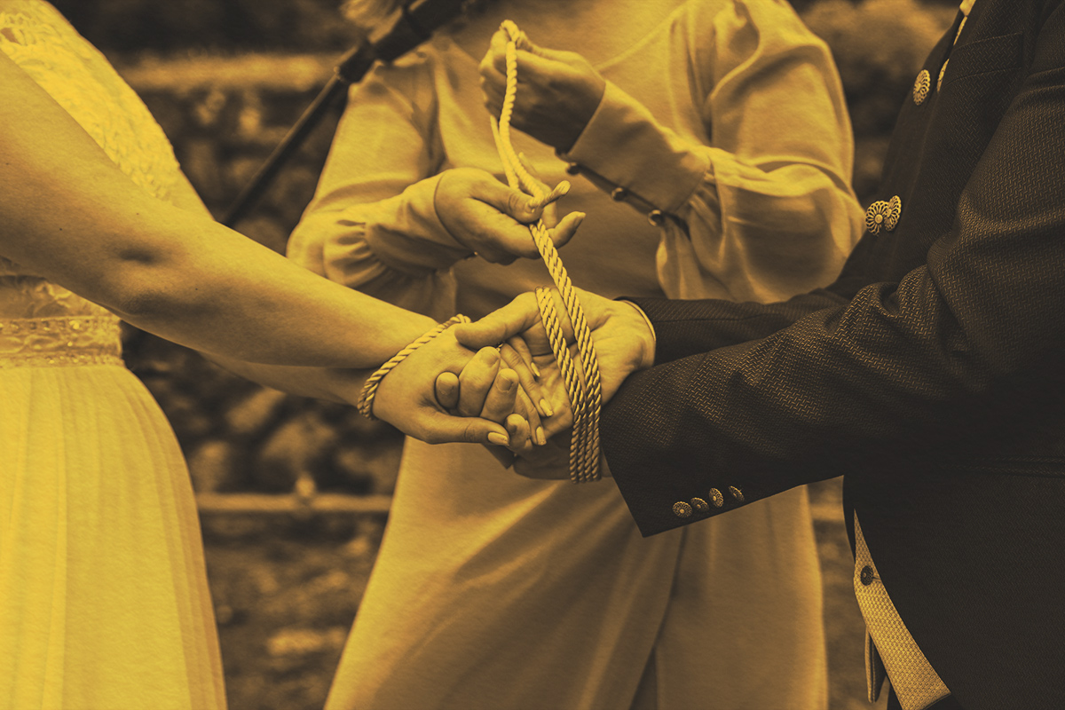 A traditional tie the knot ceremony during a wedding