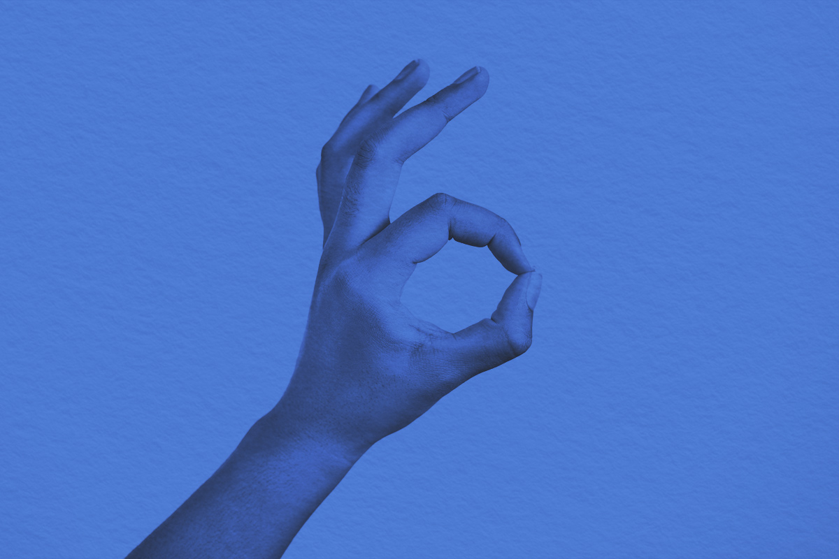 Woman making an "a-OK sign with her hand