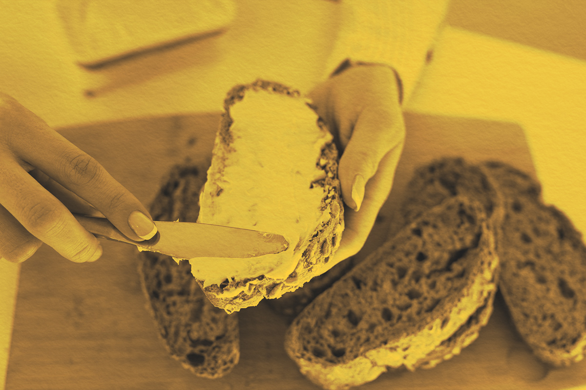 spreading butter on bread