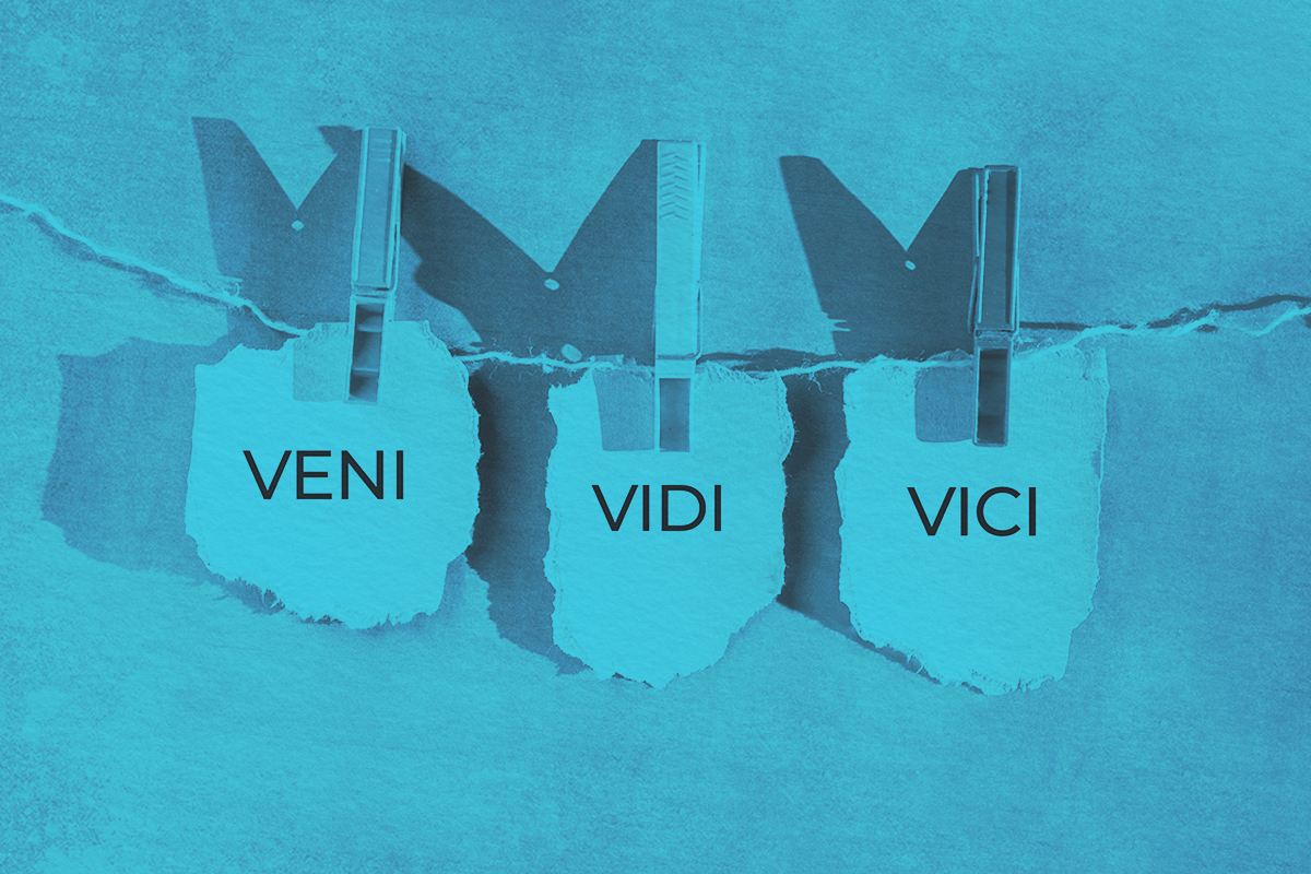 Paper sheets on a rope with words Veni Vidi Vici