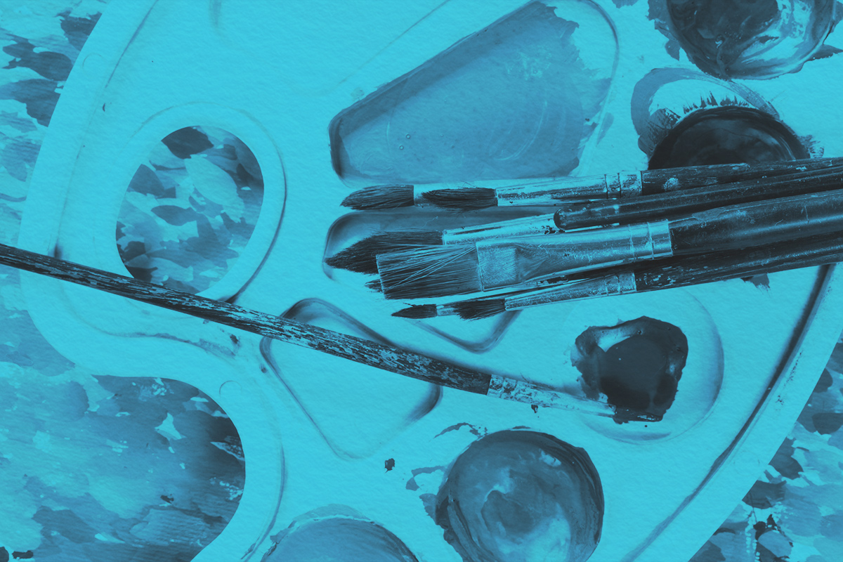 Close-up of watercolor paints and paintbrushes for painting