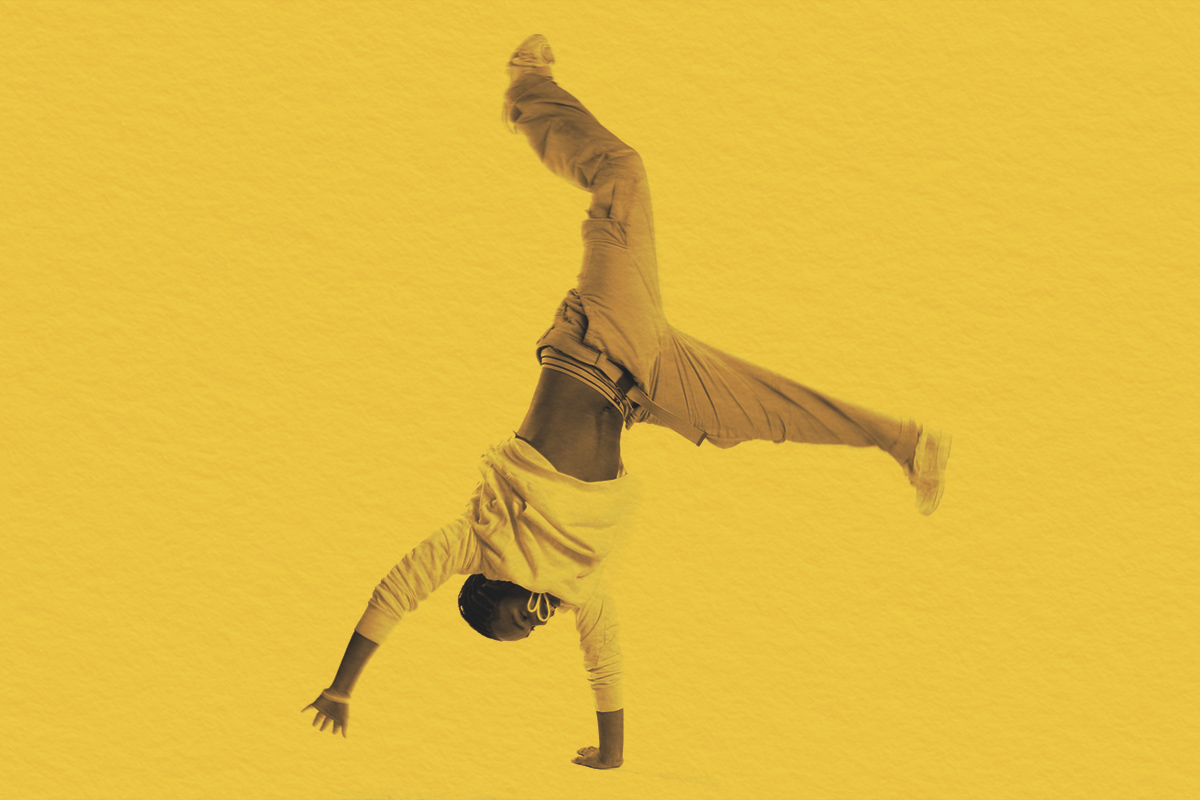 teenage boy in mid-cartwheel