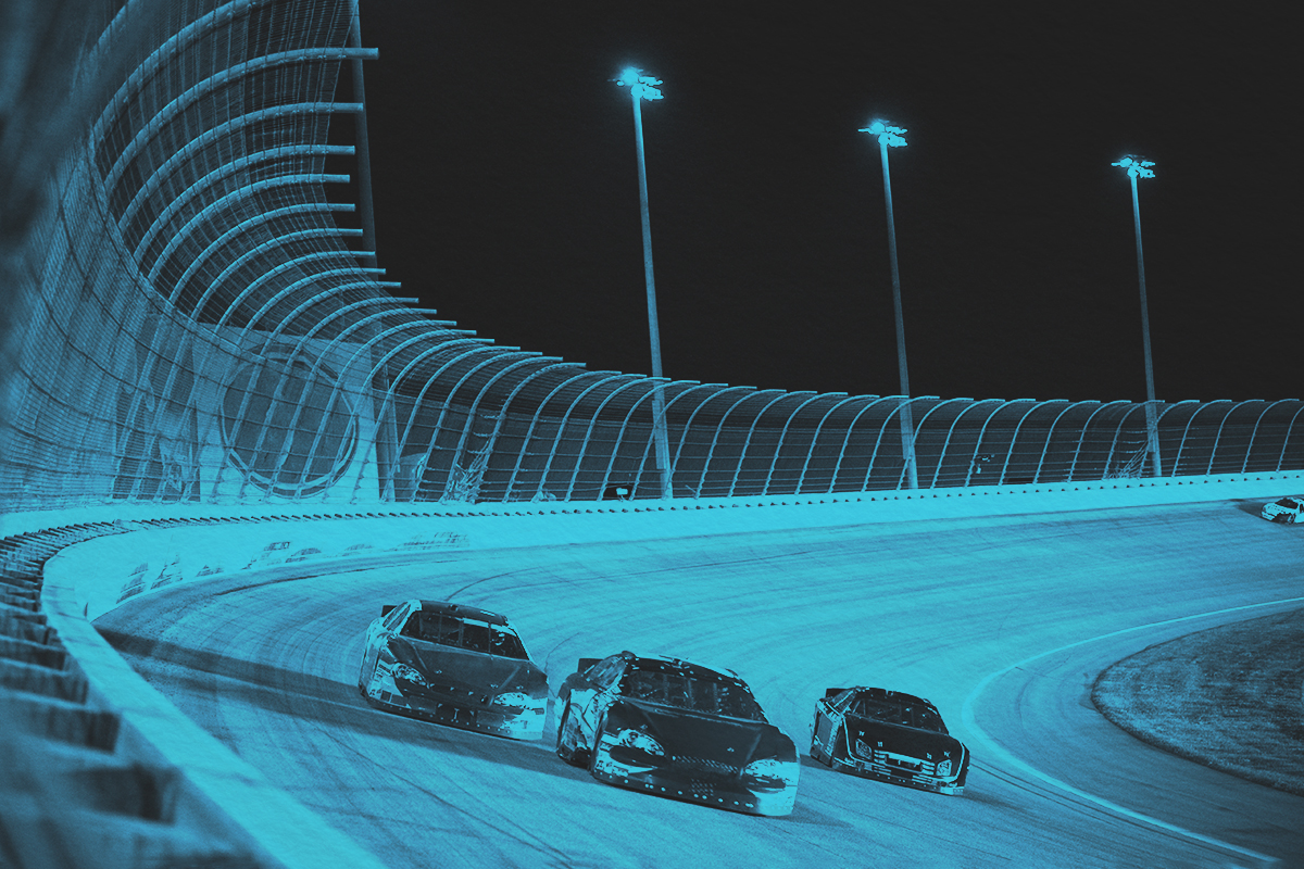 Three cars racing on a track