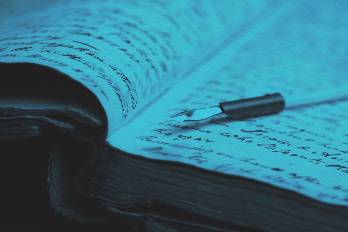 Quill pen and old notebook