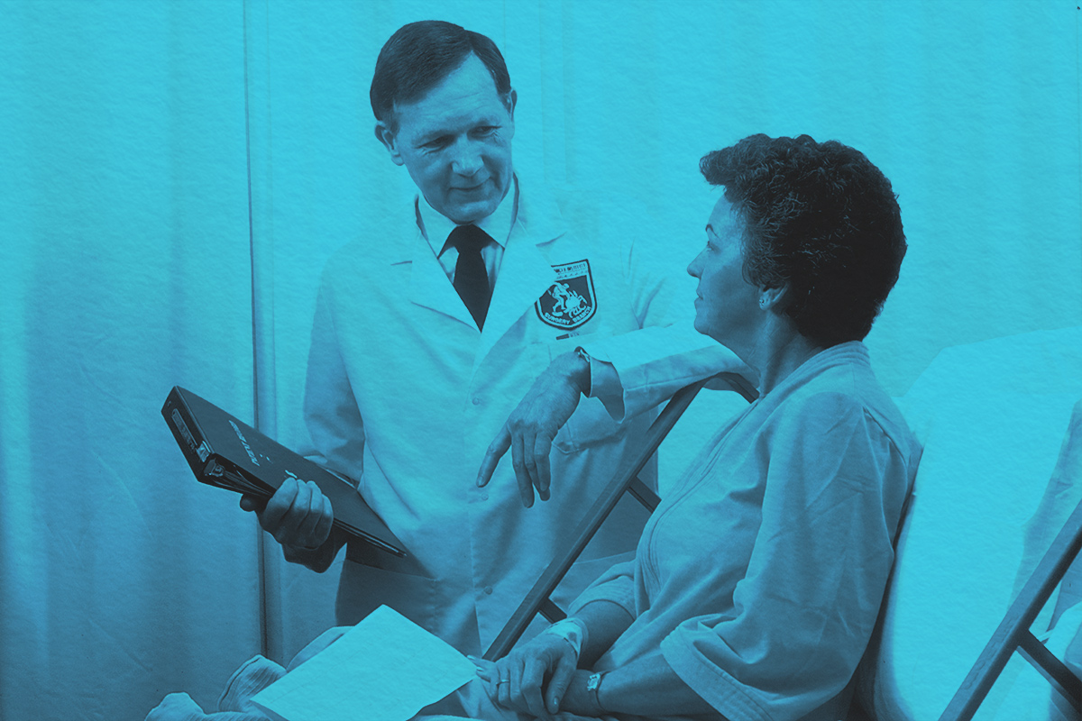 Male doctor with female patient in hospital