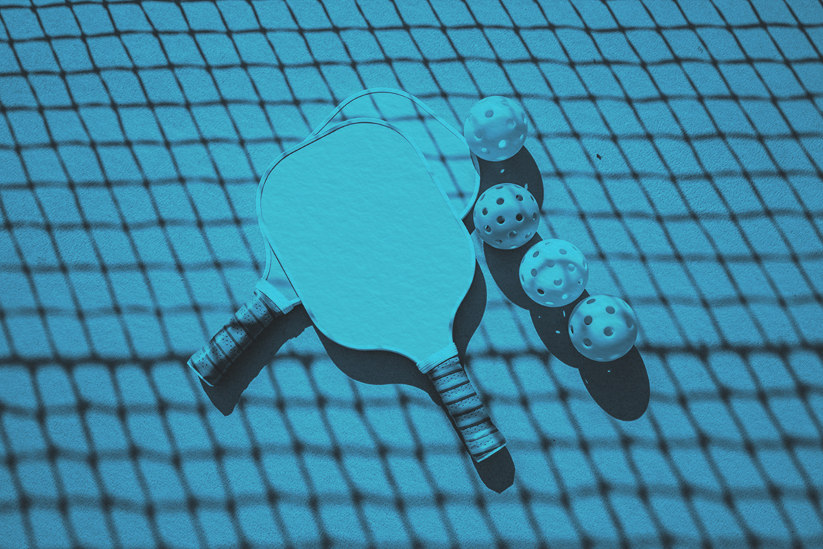 Pickleball rackets and balls on a court