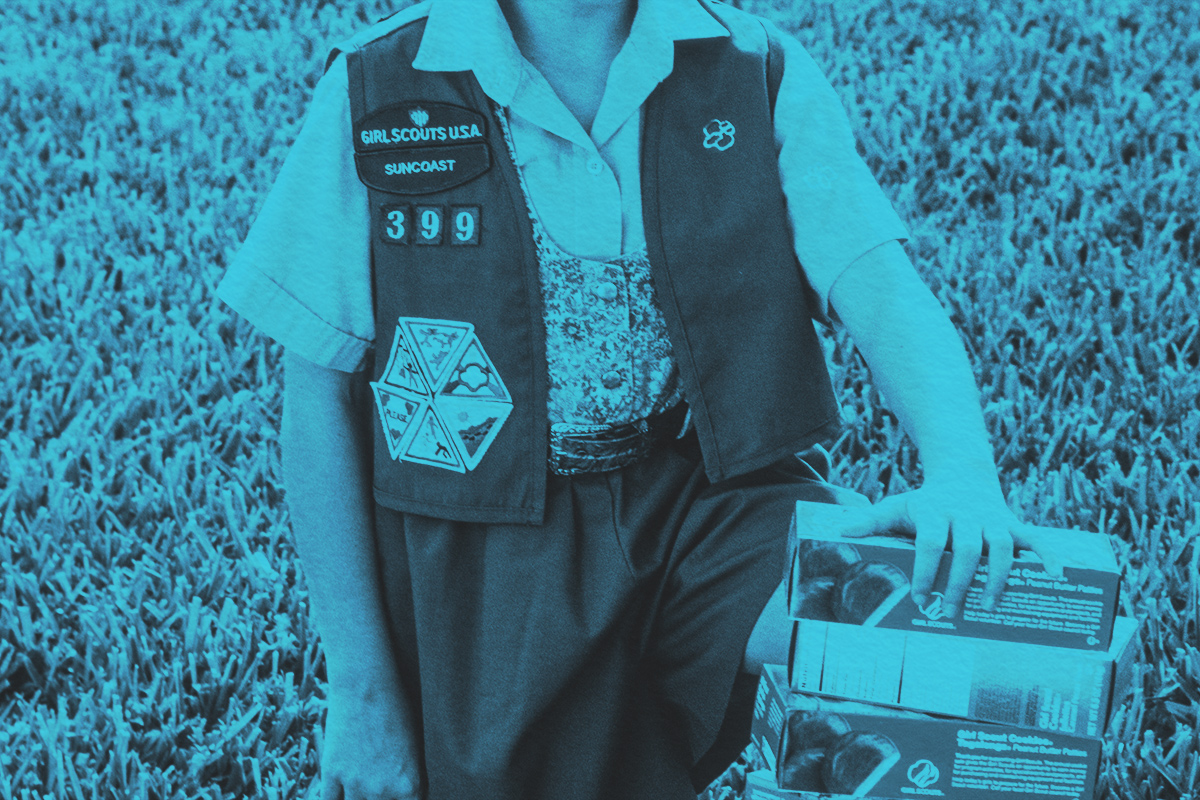 Young Girl Selling Girl Scout Cookies