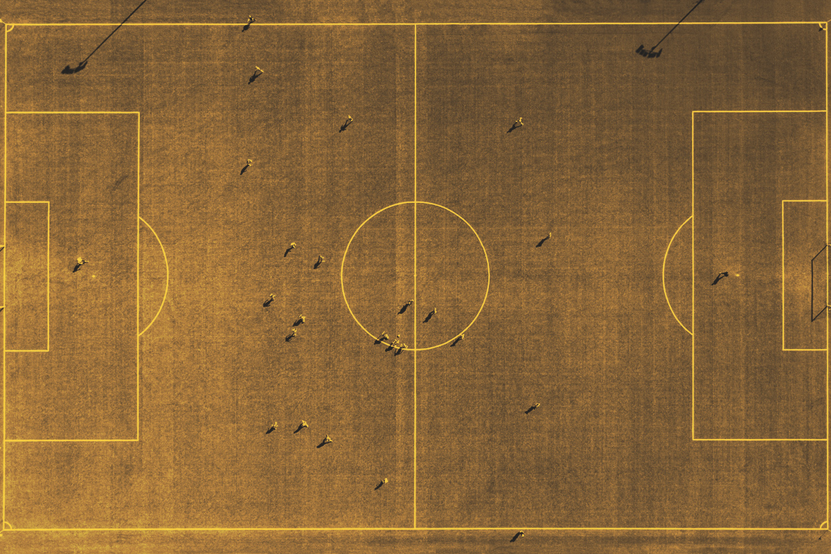 Aerial view of football field with player silhouettes