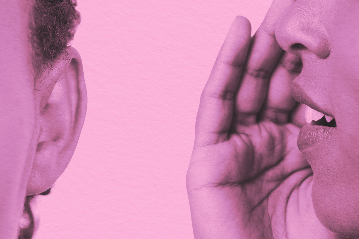 Close-up of whispering in someone's ear