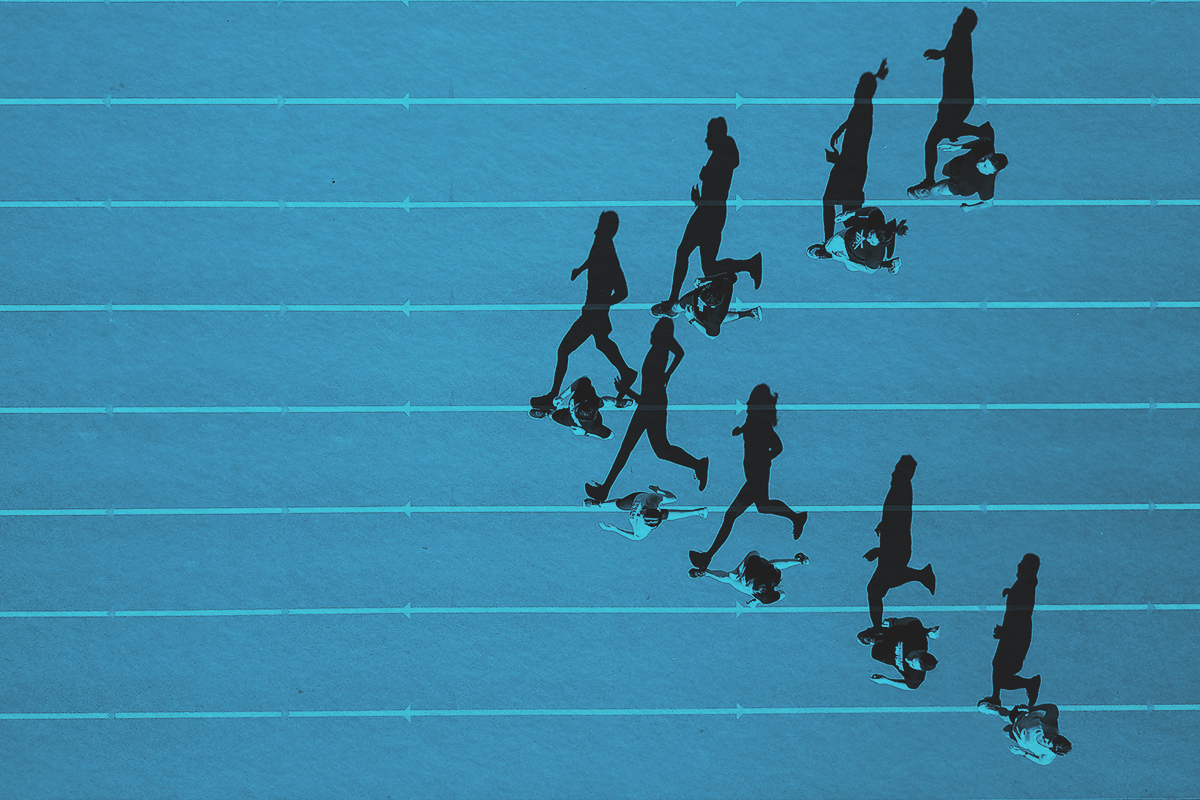 Aerial view of a group of people running on a track