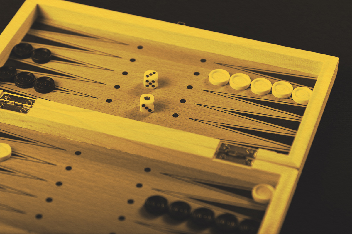 Board for playing backgammon with pieces and dice