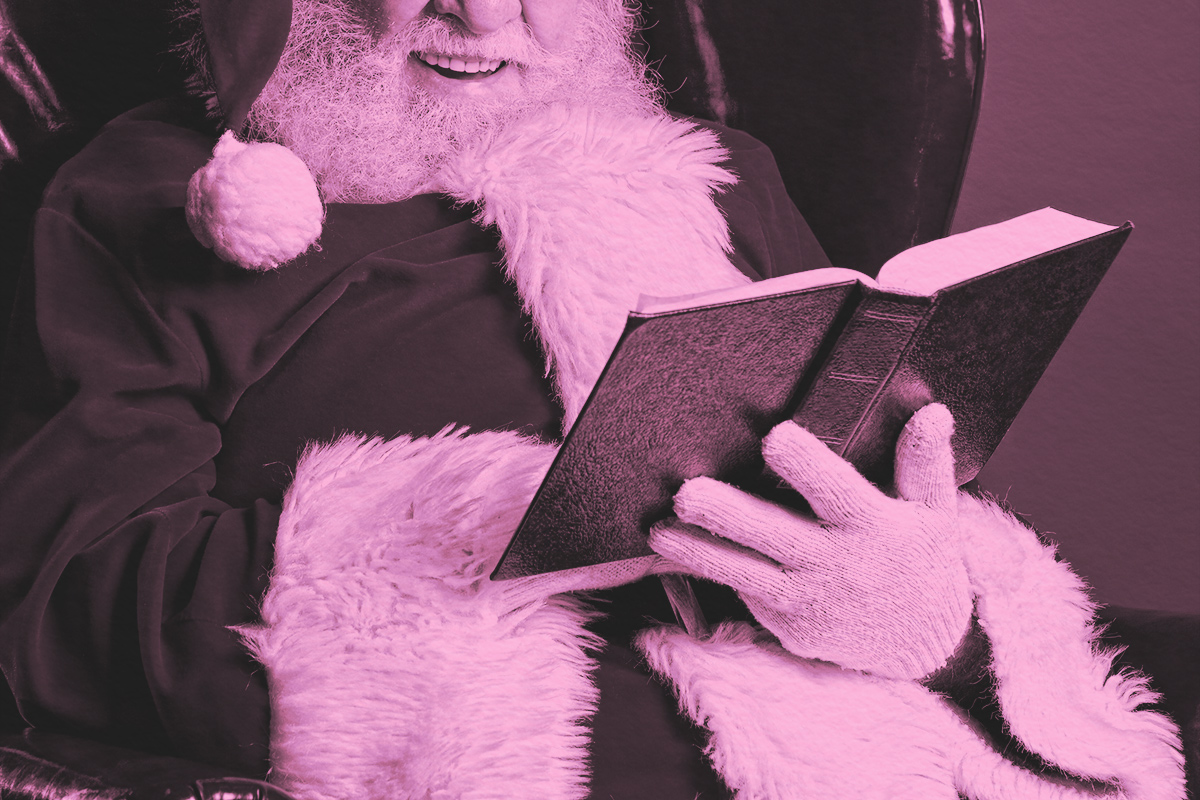 Santa Claus reading a book