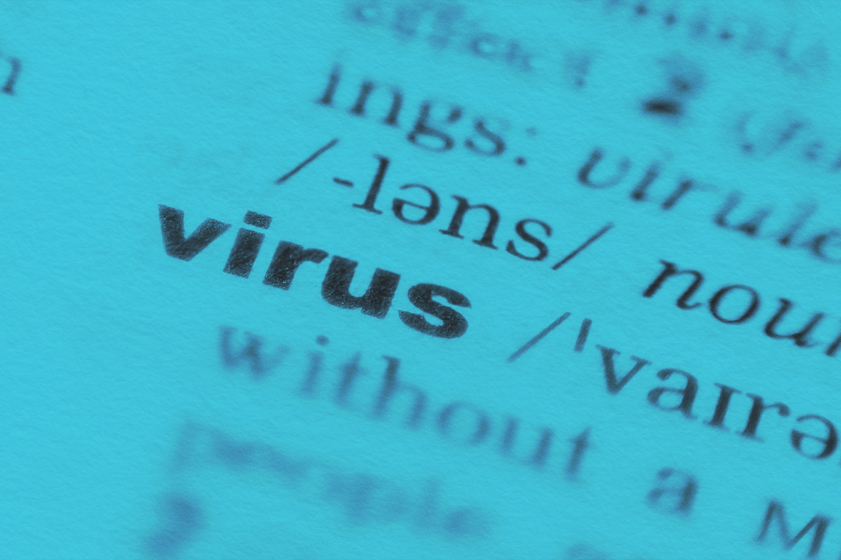 Virus word focused close up in the dictionary