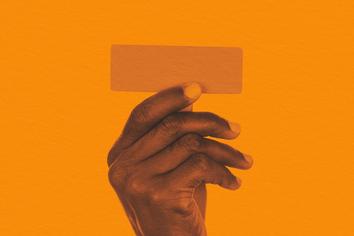 Hand holding punctuation mark hyphen