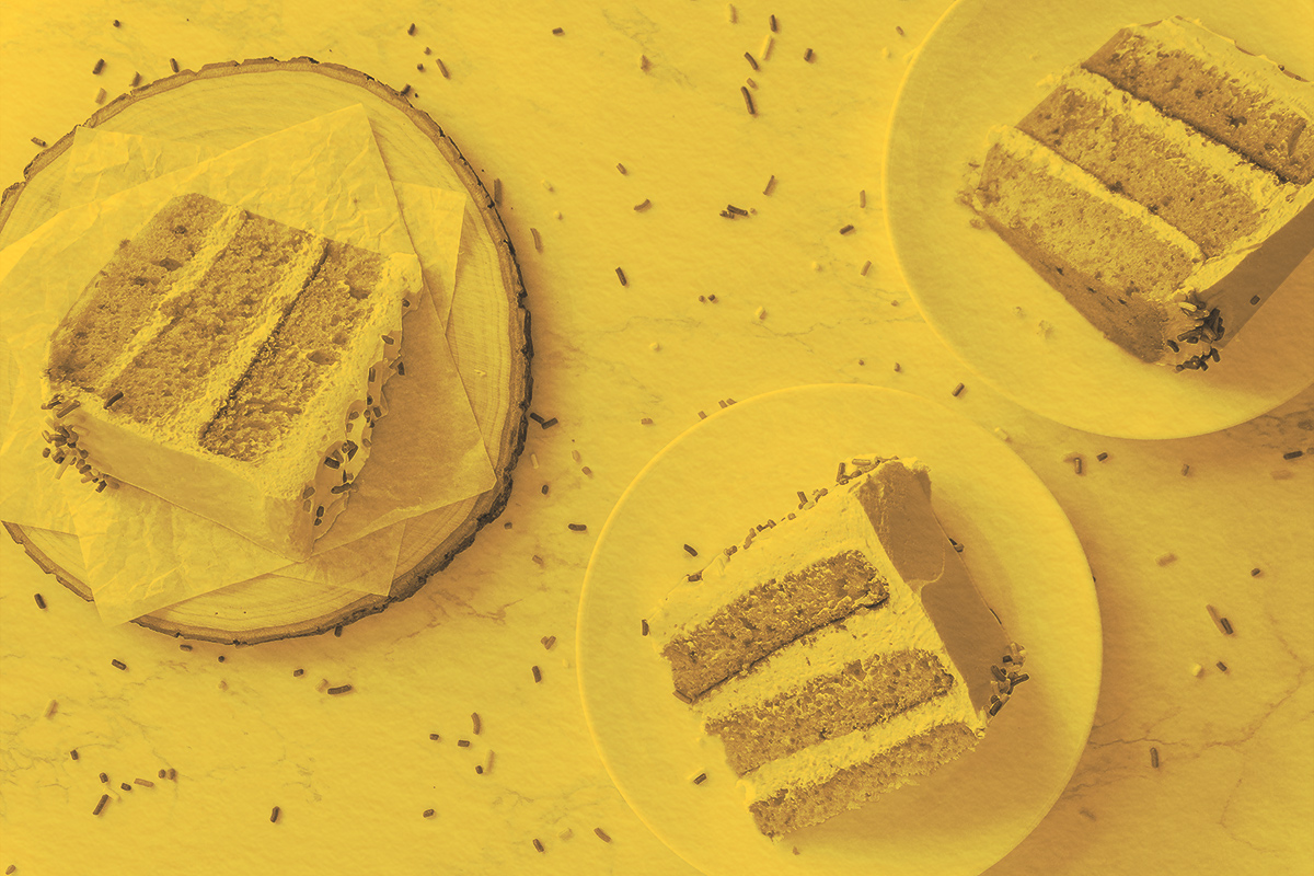 Slices of cake on table with sprinkles