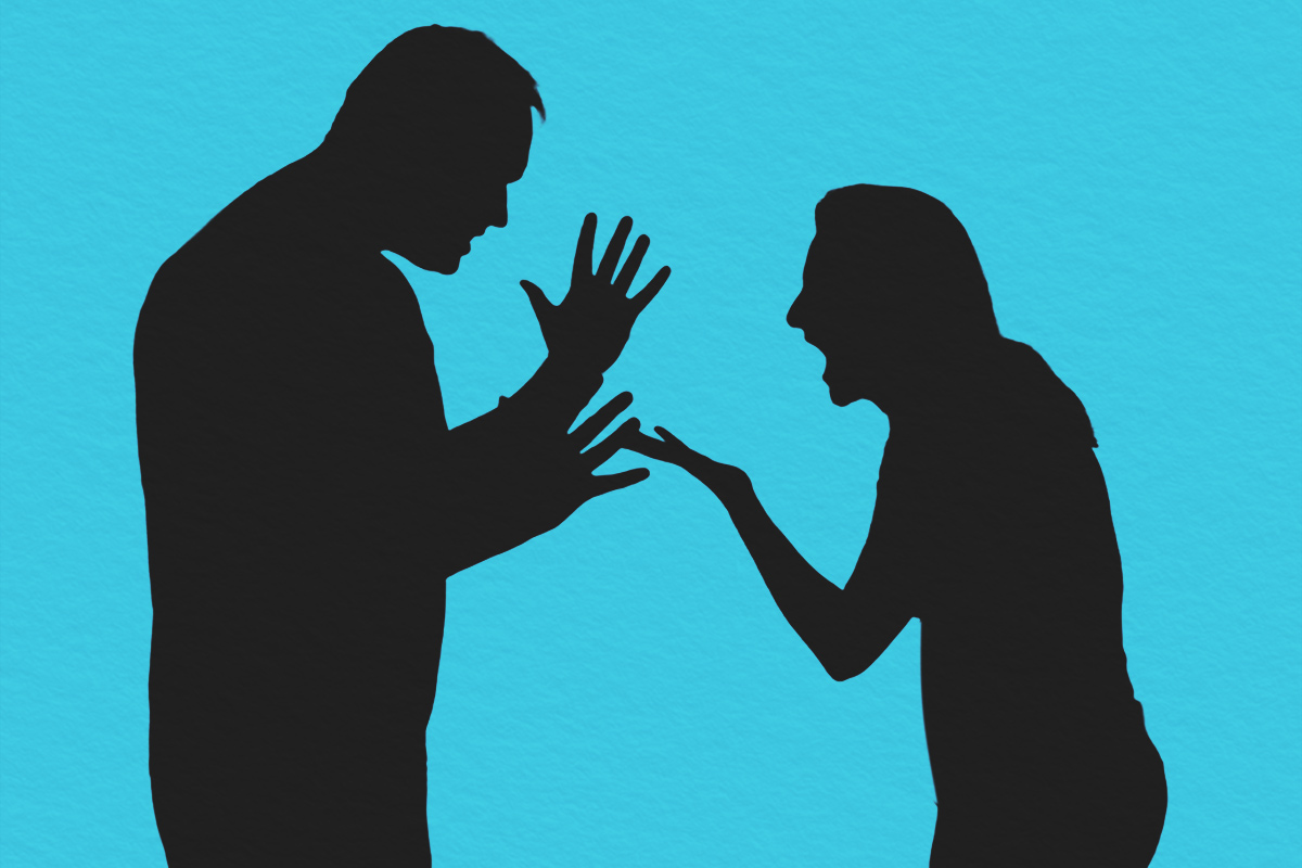 Silhouette of two people arguing