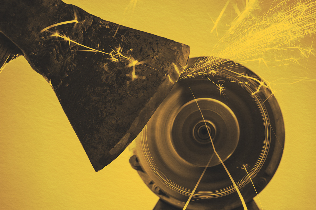 Close-up of axe sharpening