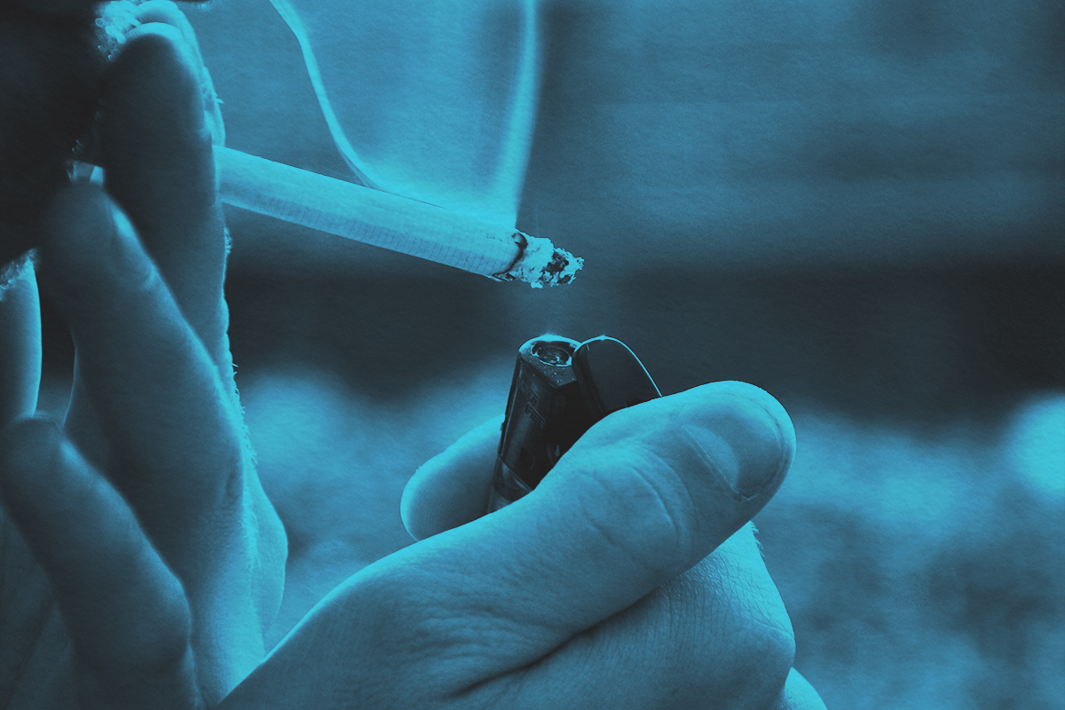 Close-up of lighting a cigarette