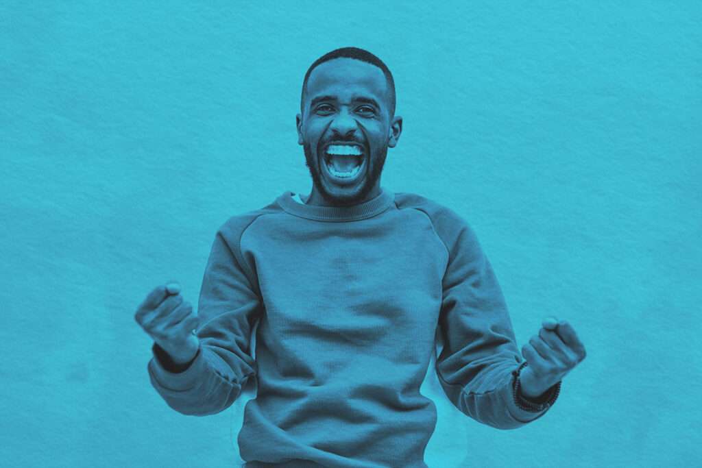 A joyful man with a beard expressing excitement